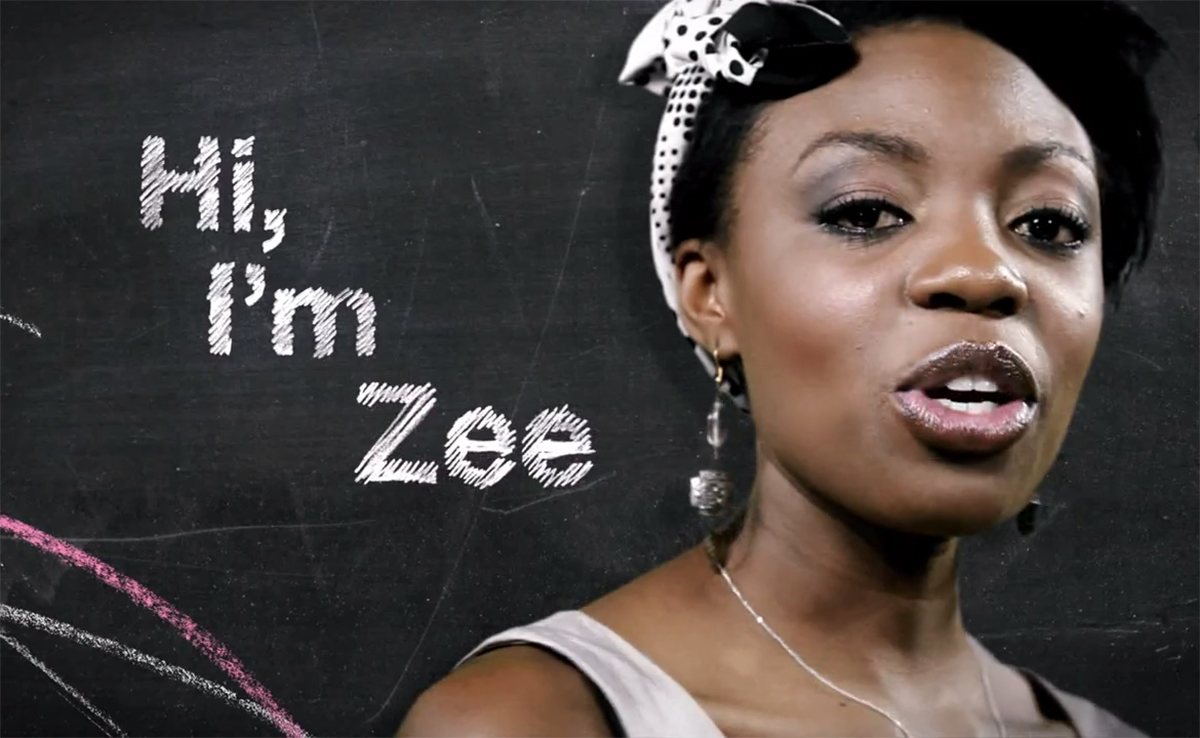 Image of a young woman speaking with the words "Hi, I'm Zee" written on a chalkboard in the background.