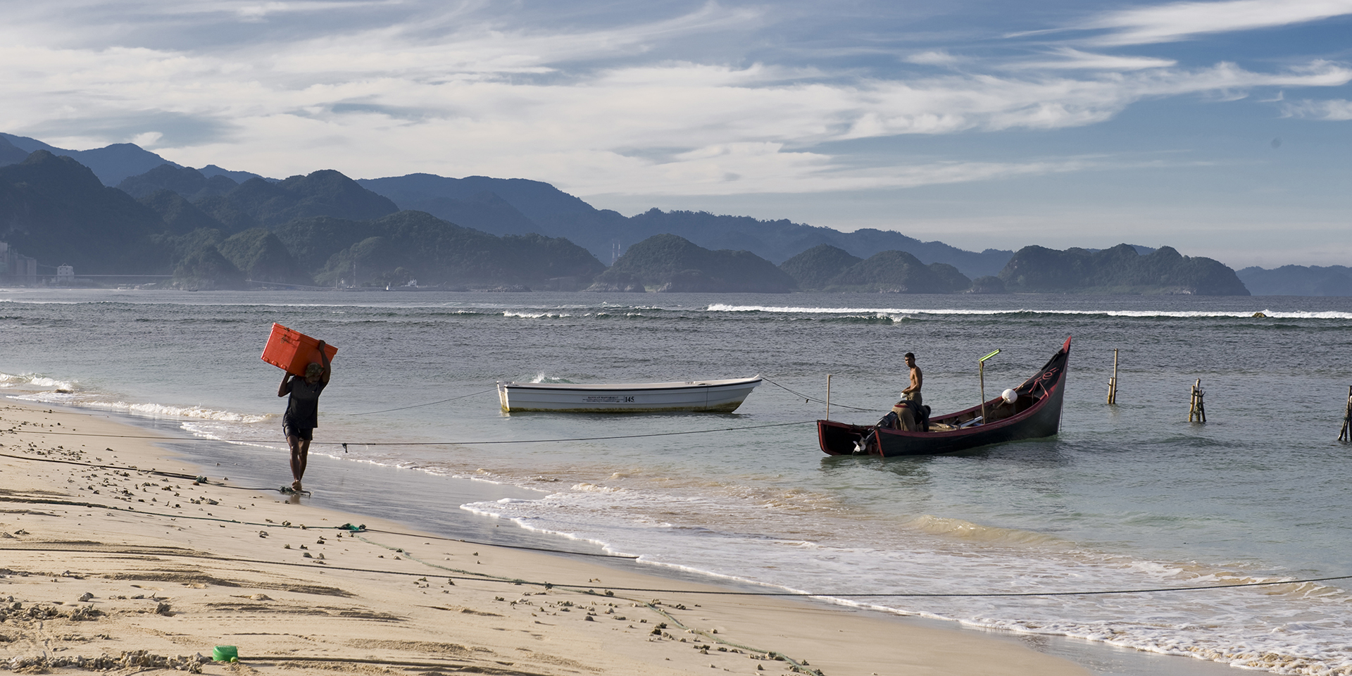 A beach with fishing boats