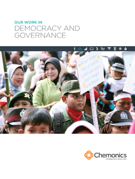 The front page of a report titled "Our Work In Democracy and Governance." Includes a photo of several people marching and holding signs.