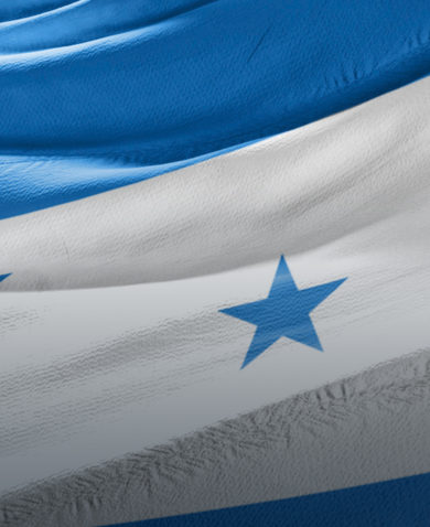 A close-up image of the Honduran flag waving.