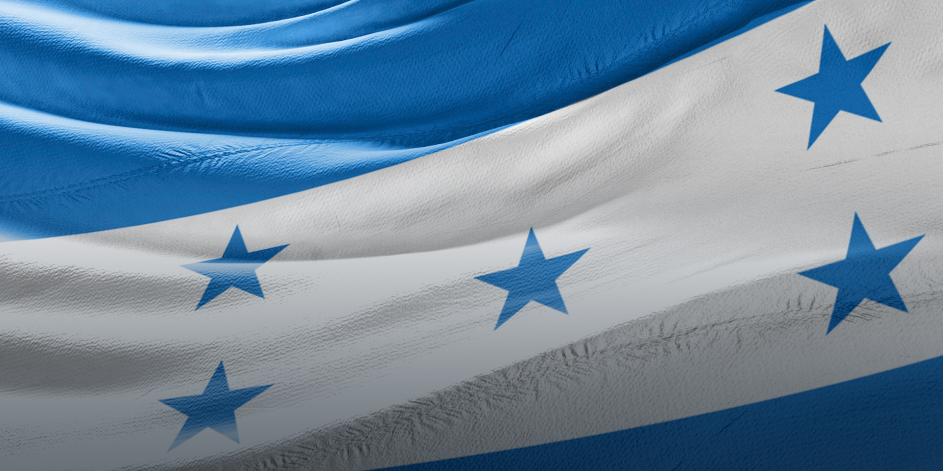 A close-up image of the Honduran flag waving.