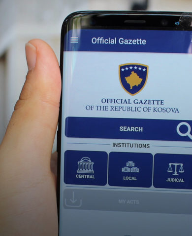 A phone displays the Official Gazette of Kosovo mobile app