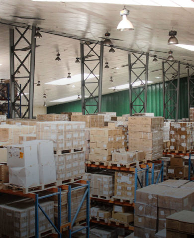 A large warehouse filled with boxes stacked on pallets.