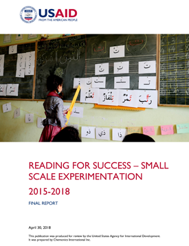 The front page of the final report titled "Reading For Success - Small Scale Experimentation." Includes an image of a young girl looking at large flashcards taped onto a blackboard.