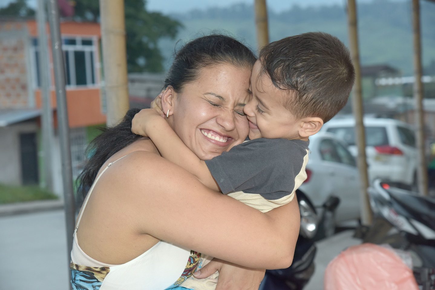 Colombian mother hugging child