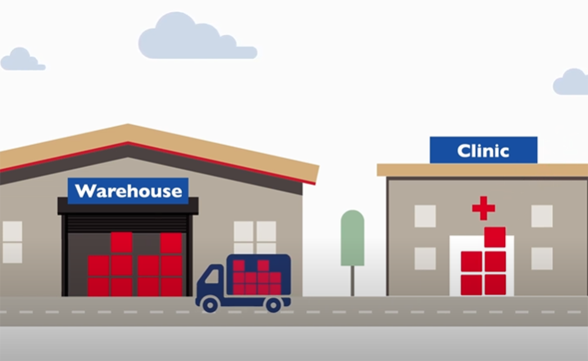 An illustration of a warehouse and a clinic on a street with a truck passing by.