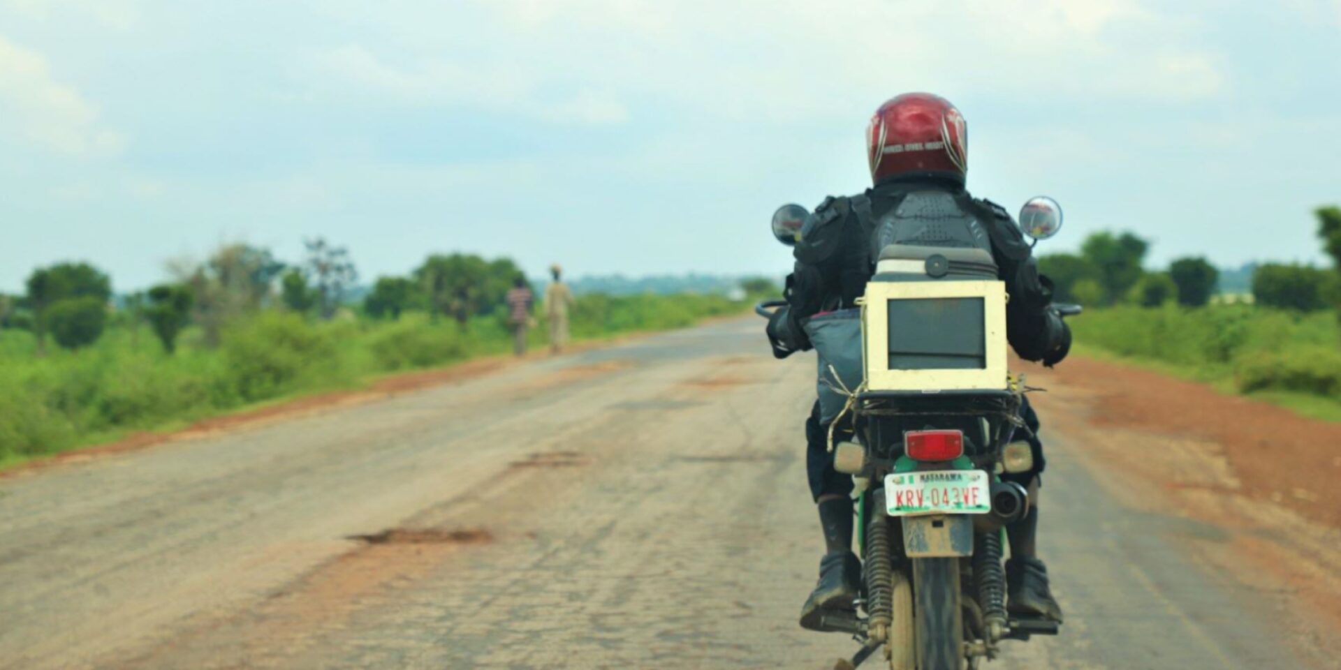 A third party logistics provider uses a motorbike to transport samples across Nigeria.