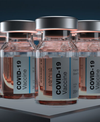 Severa; vials of COVID-19 vaccine set on a table.