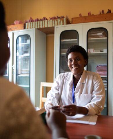 Doctor provides counseling service to patient in Rwanda.