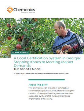 The front page of a technical brief titled "A Local Certification System in Georgia: Steppingstones to Meeting Market Demands." Includes an image of a man holding a basket and picking fruits from a tree.