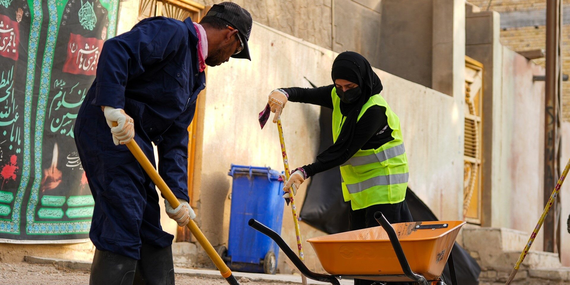 A woman participating in a cleanup campaign in a more conservative locality in Iraq.