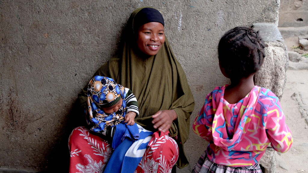 Zainabo (middle) regularly helps women in her community give birth. 