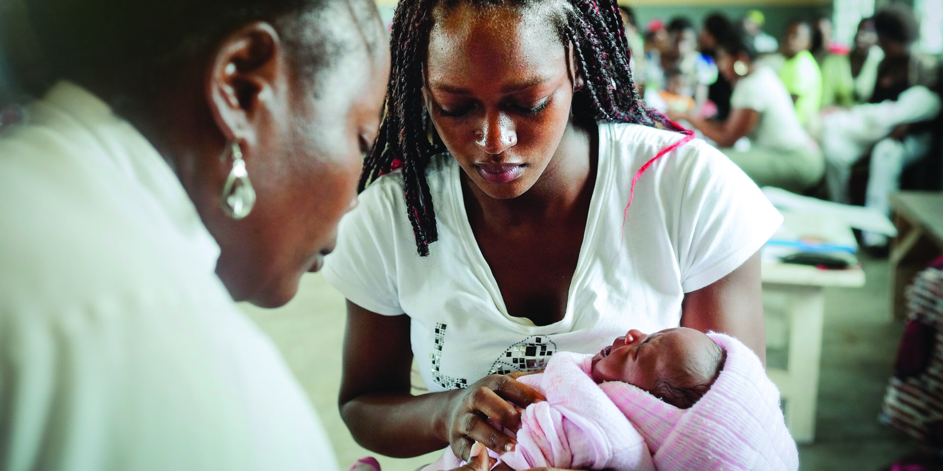 health worker vaccinating a baby
