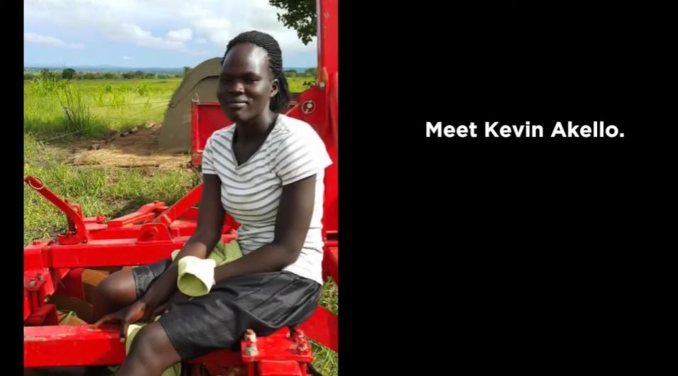 Kevin Akello on a tractor