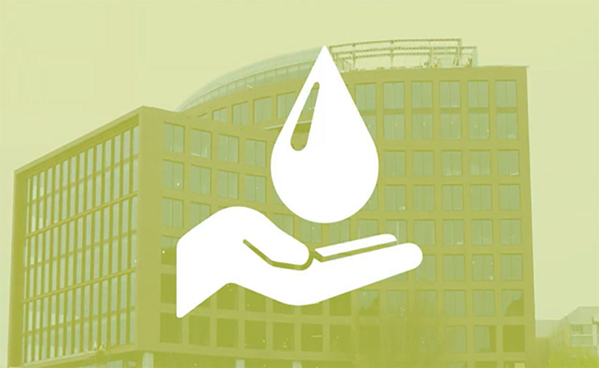 Image of a tall building overlaid with a graphic of an open hand under a drop of water.