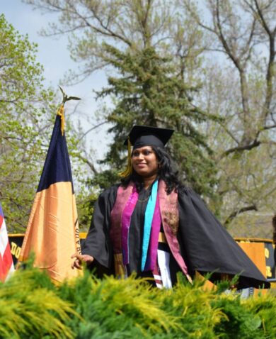 Achini Wijesinghe walks during her graduation from Colorado College