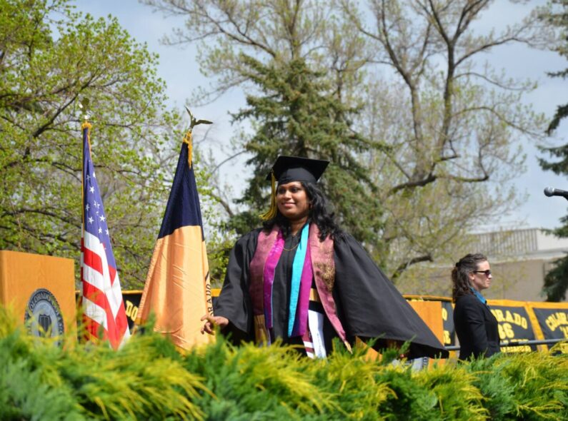 Achini Wijesinghe walks during her graduation from Colorado College