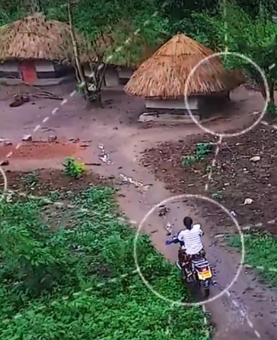 A woman rides a motorbike along a path, while animated circles representing connection follow her.