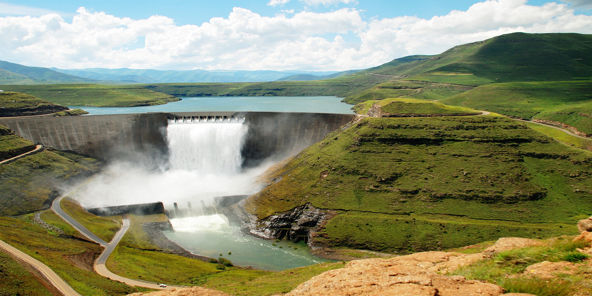 An aerial image of Katse Dam in Lesotho overflowing with water