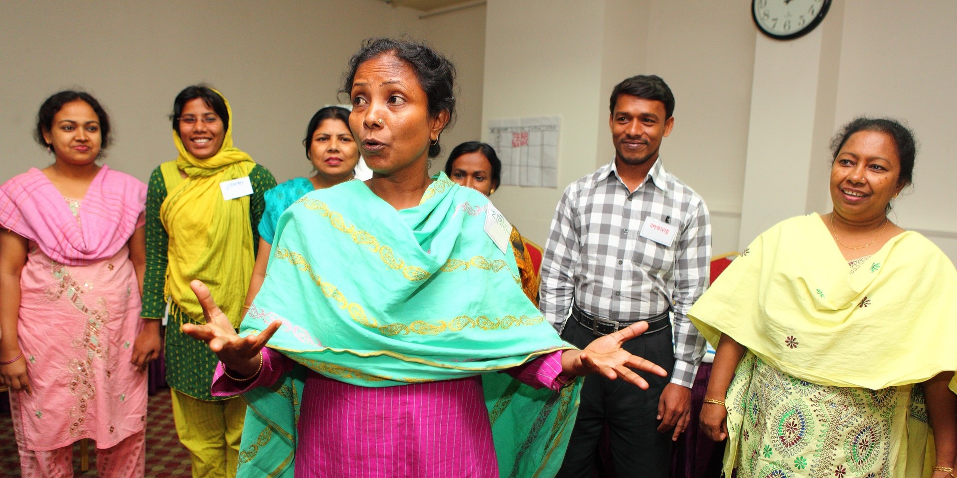 Clinic staff practice facilitating group meetings during a Surjer Hashi Health Group training session in Bangladesh