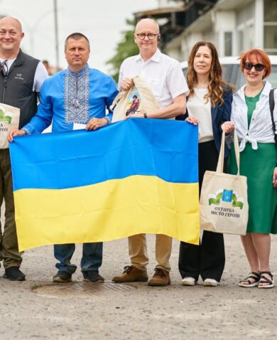 A group of people holding the Ukraine flag.