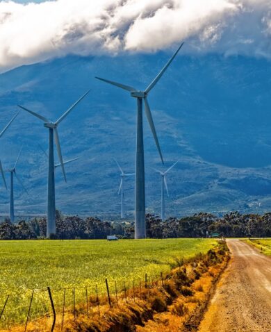 Wind turbines in front of a cloud covered mountain in Drakenstein, South Africa
