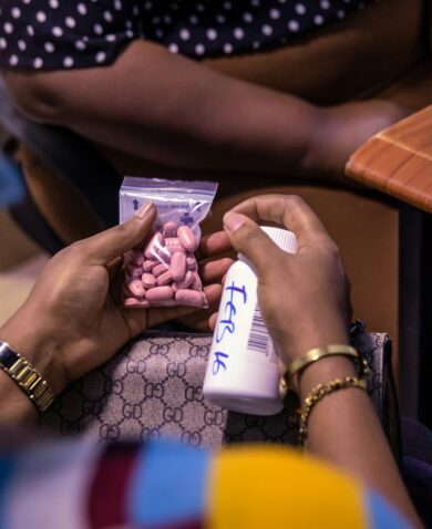 A patient receives HIV medication at a clinic in Nigeria