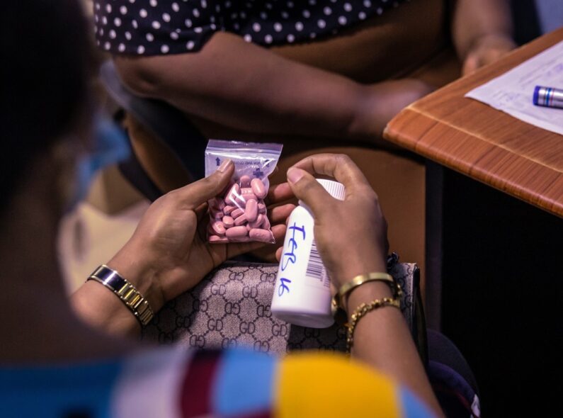 A patient receives HIV medication at a clinic in Nigeria