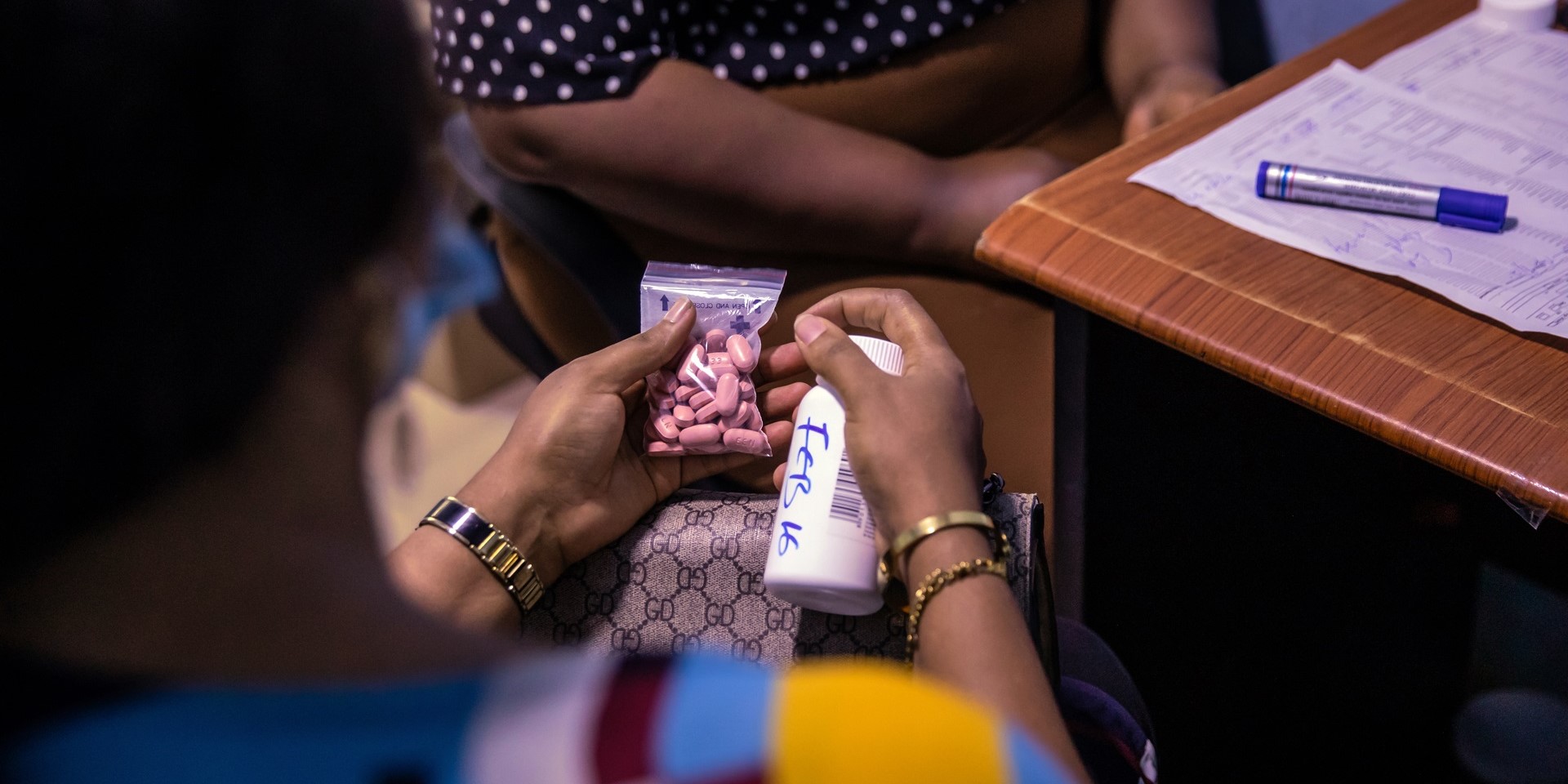 A patient receives HIV medication at a clinic in Nigeria